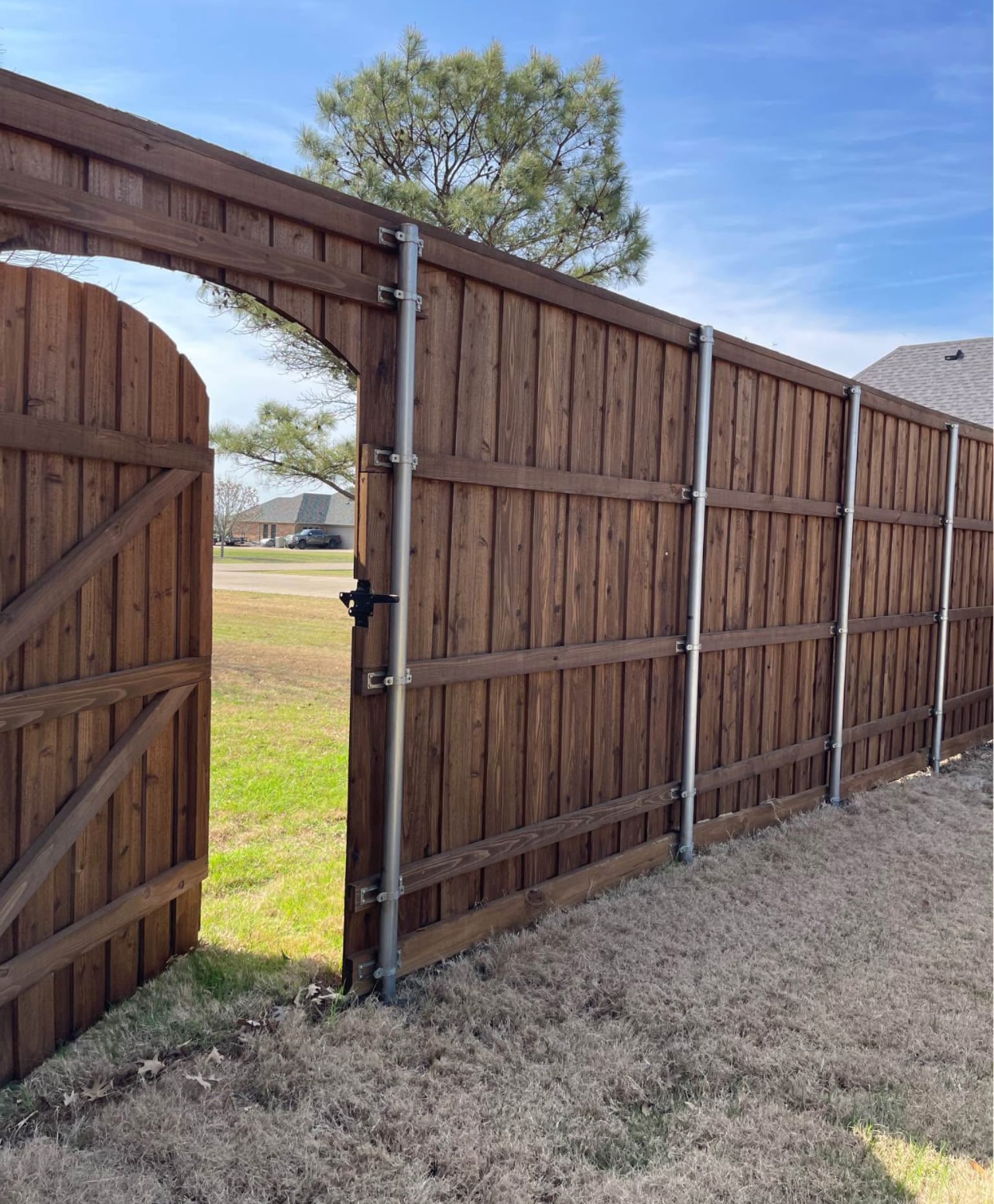 Privacy fence with arched gate in Denton County TX by Landeros Fence