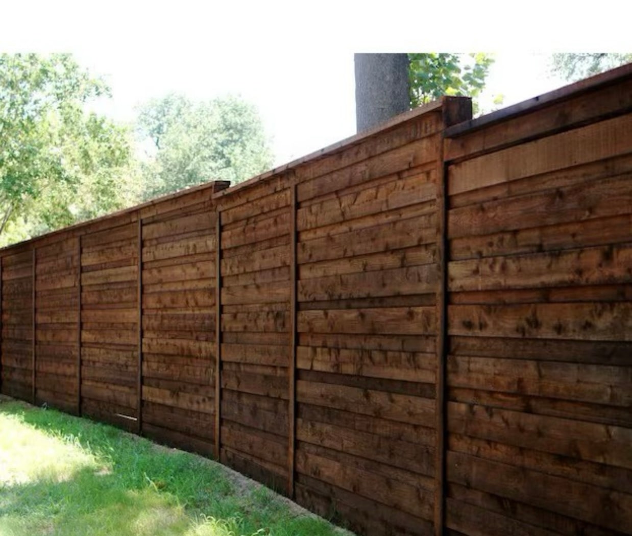 Long cedar privacy fence backyard installation in Aubrey TX by Landeros Fence