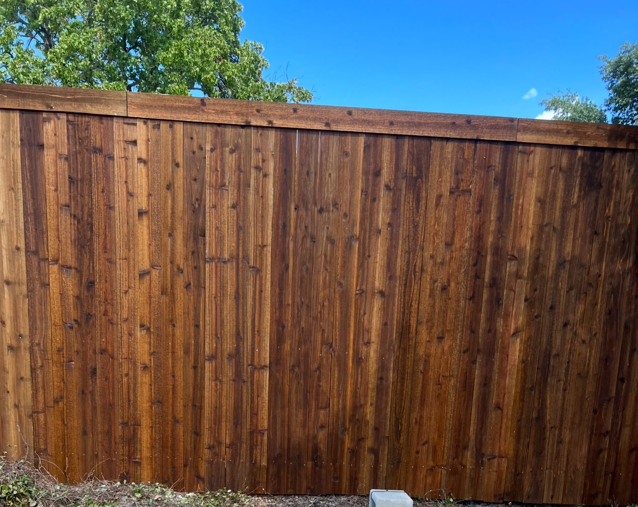 Stained cedar fence close-up detail in North Texas by Landeros Fence