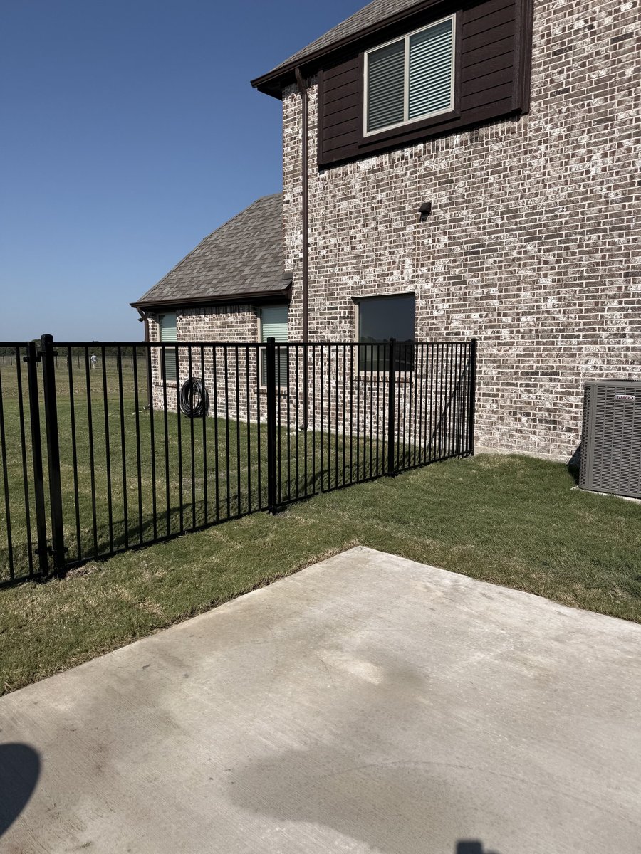 Tall cedar privacy fence in Argyle TX by Landeros Fence & Construction